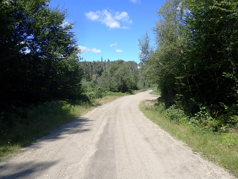 dirt road with sunny sky